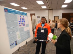 SEERS Student Representative Mary Grace Lemon (UNCW) talks diatoms with graduate student Brian Murry (Savannah State Univ.)
